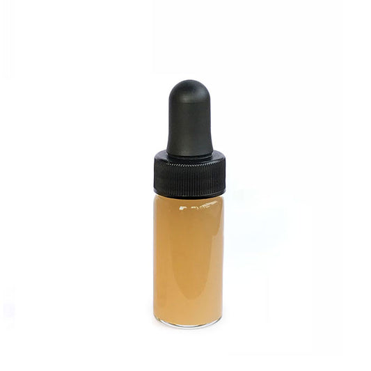 9 ml Katukina Sananga eye-drop bottle: clear glass filled with amber-colored liquid and topped with a black rubber dropper