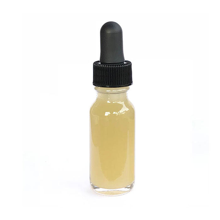 15 ml Yawanawa Sananga eye-drop bottle: clear glass filled with amber-colored liquid and topped with a black rubber dropper