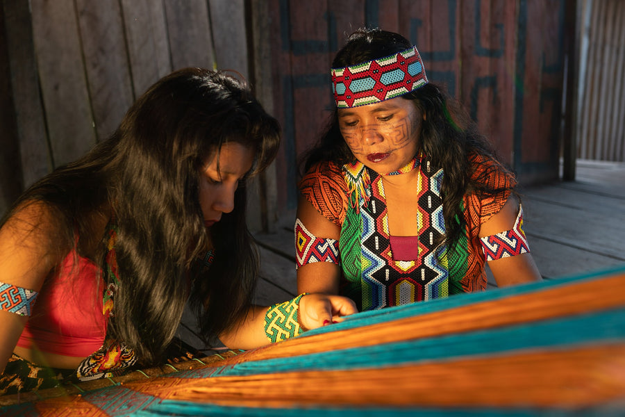 Huni Kuin women weaving traditional textiles by hand