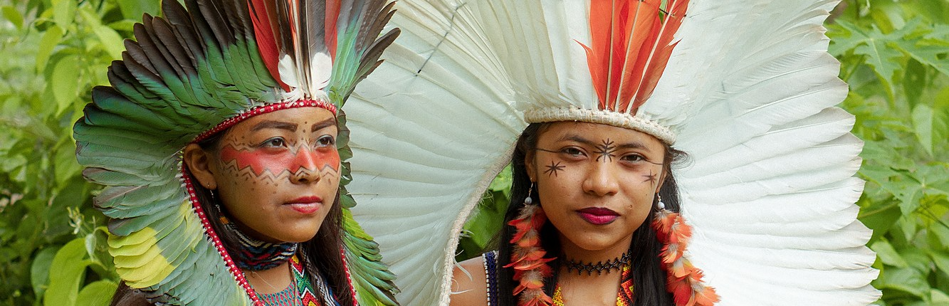 Huni Kuin women in feather headdresses